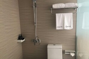 A modern bathroom with a shower, toilet, and towel rack. - yun jing Hotel (Shanghai Songjiang University Town) (Shanghai)