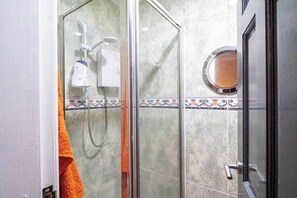 Shower, towels, soap, toilet paper