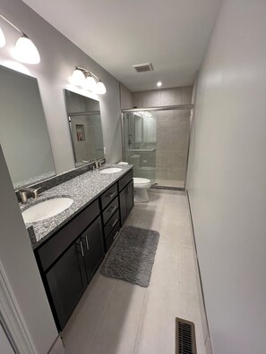 Shower, towels, soap, toilet paper