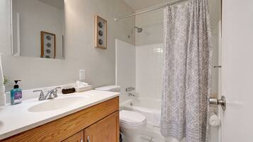 Hair dryer, towels, soap, shampoo