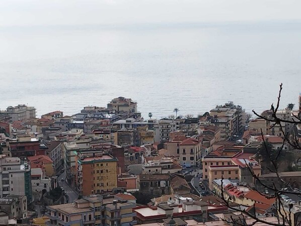 A densely packed urban area with buildings close to a body of water.