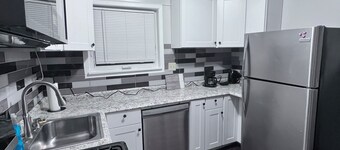 A big "Tiny" home, with large enclosed yard, next to train in downtown Westmont.