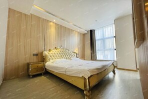 A bedroom with a large bed, a nightstand, and a window with curtains. - Zhaoyuan Wenfeng Hotel (Zhaoyuan)