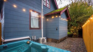 A spa area with a hot tub and an air conditioning unit. - 2BR/1BA • Big Yard • Near Moda Center | Hot Tub (Portland)