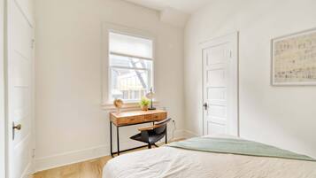 1 bedroom, desk, iron/ironing board, travel crib