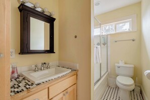 Shower, hair dryer, towels, shampoo