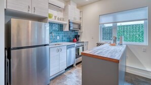 A modern kitchen with stainless steel appliances, a microwave, and a built-in oven.