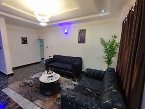 Deluxe Apartment, Balcony, City View | Living area - Donho Luxury Apartment (Owerri)