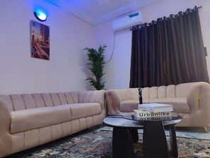 Deluxe Apartment, Balcony, City View | Living area - Donho Luxury Apartment (Owerri)