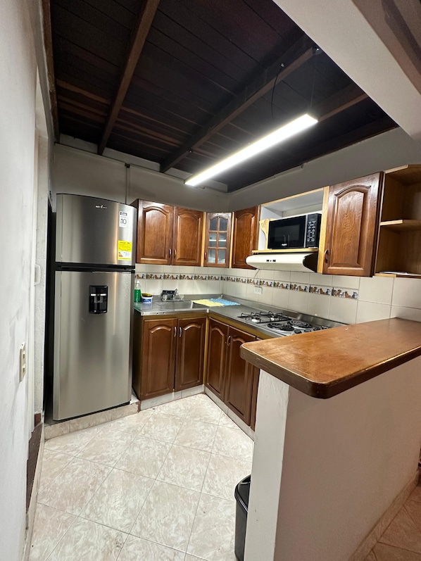 Fridge, microwave, cookware/dishes/utensils