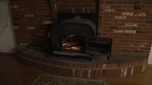 A brick fireplace with a fire burning inside. - 10acre Serene Retreat W/ ⭐️⭐️⭐️⭐️⭐️Private Chef Availability!!  (Mars)