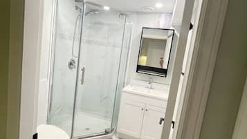 Shower, towels, soap, toilet paper