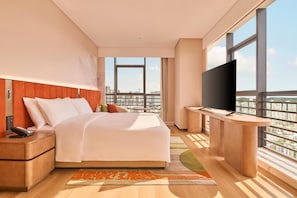 Deluxe Suite, 1 King Bed | Down comforters, desk, blackout drapes, iron/ironing board