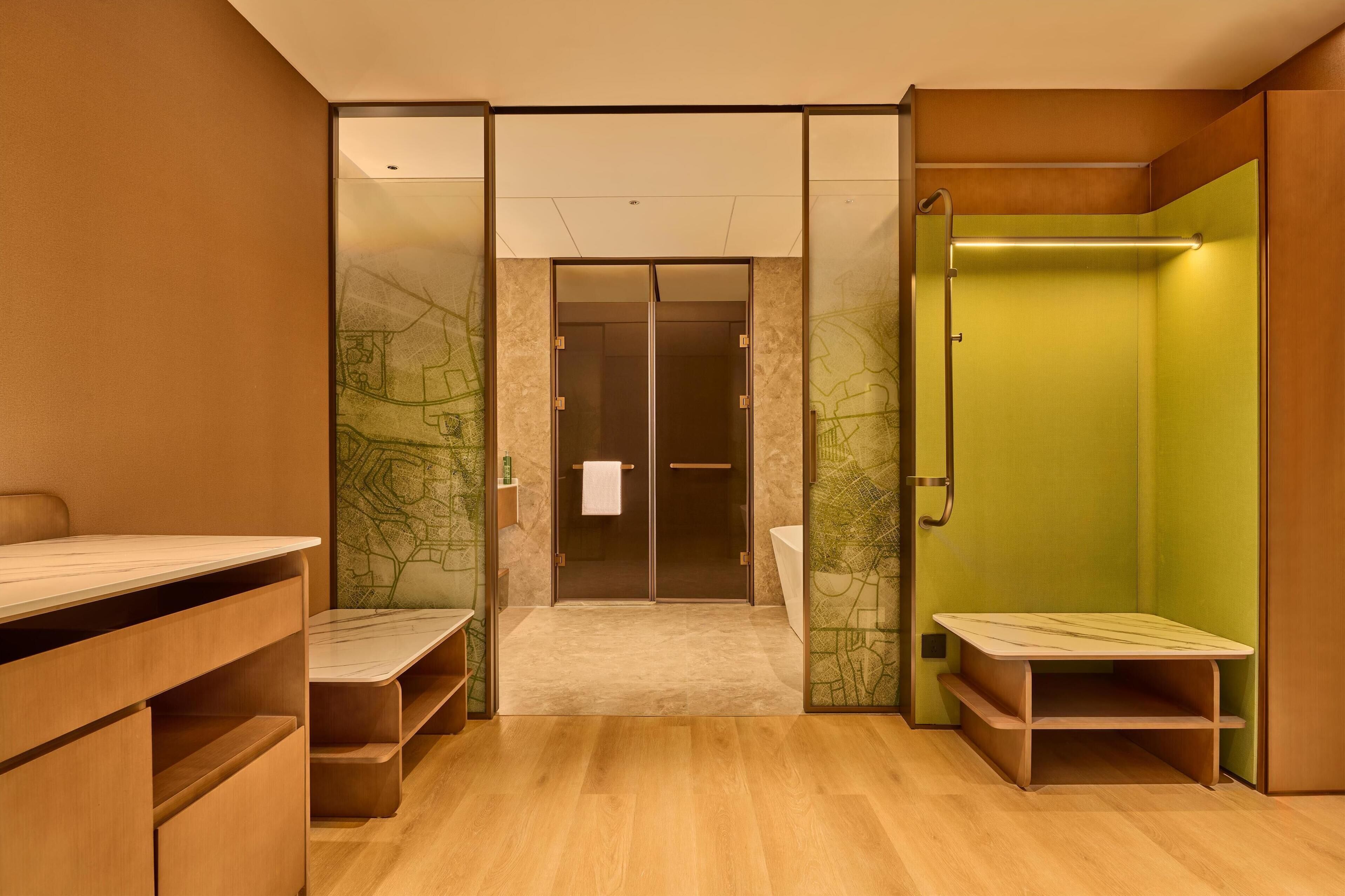 A modern bathroom with a shower, a toilet, and a vanity with a mirror.