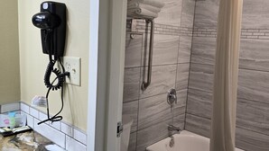 Basic Double Room | Bathroom | Hair dryer, towels, soap, shampoo - Trappers Inn & Campground (Belfield)