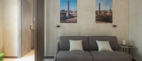 Family Suite | Living area | 55-inch Smart TV with satellite channels