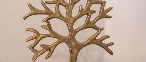 A decorative tree sculpture on a wooden base.
