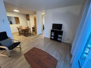 Bright and inviting lounge area with ample natural light, ideal for unwinding. Features fast Wi-Fi and air conditioning for ultimate comfort.