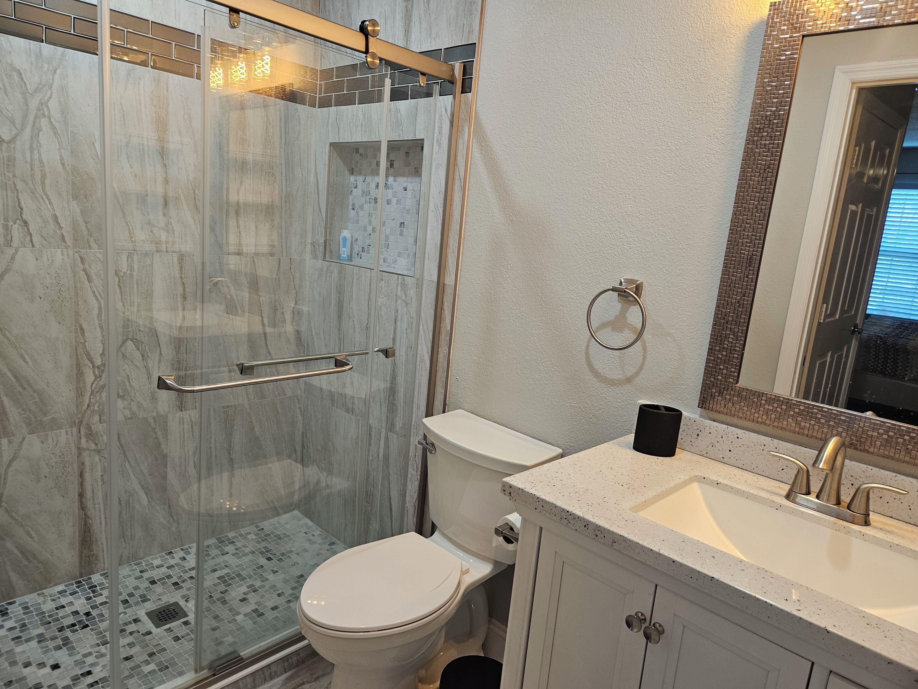 Shower, hair dryer, towels, toilet paper