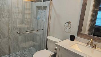 Shower, hair dryer, towels, toilet paper