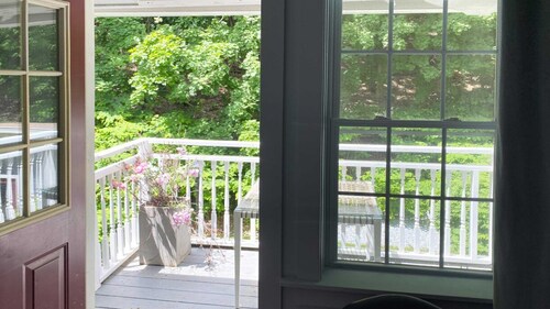 Cozy Carriage House room with a double bed and private balcony