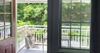 Cozy Carriage House room with a double bed and private balcony