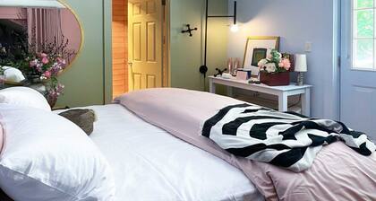 Cozy Carriage House room with a double bed and private balcony