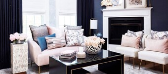 Elegant suite with a king bed, fireplace, and kitchenette.