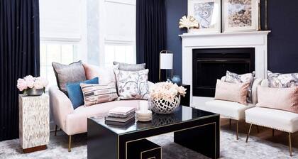 Elegant suite with a king bed, fireplace, and kitchenette.