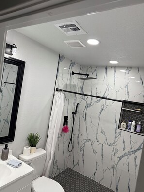 Shower, towels, soap, toilet paper