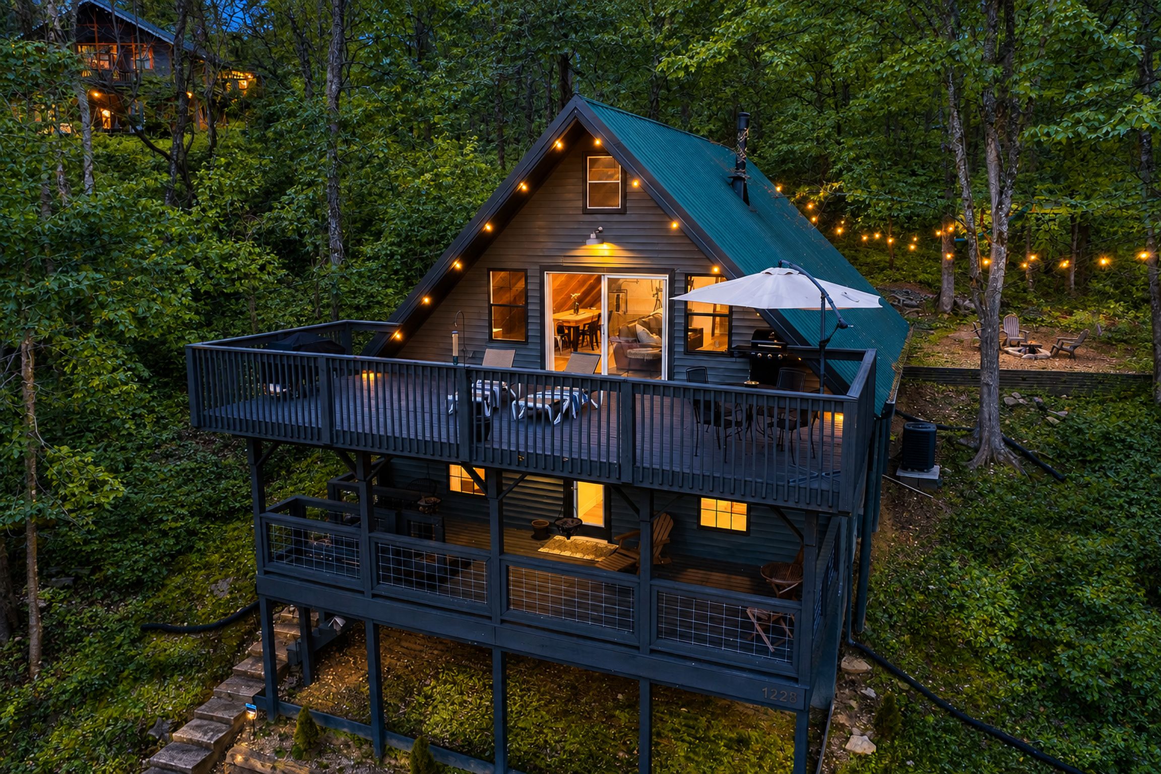 Cozy A-frame retreat with expansive decks, forest views, and fire pit