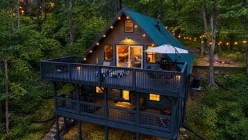 Cozy A-frame retreat with expansive decks, forest views, and fire pit