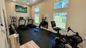 A gym with treadmills, stationary bikes, and a rowing machine. - 1BR Coastal Condo w/ Pool Access (Kitty Hawk)
