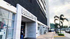 A modern building with a sign reading "BELLIN III".