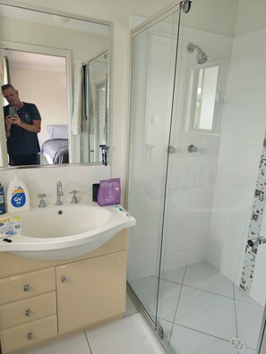 Shower, towels, soap, toilet paper