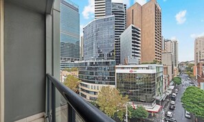 A cityscape with modern high-rise buildings, including a prominent HSBC bank.
