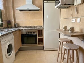 Fridge, microwave, oven, cookware/dishes/utensils