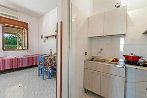 Fridge, stovetop, coffee/tea maker, cookware/dishes/utensils