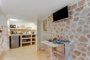 Fridge, microwave, stovetop, coffee/tea maker
