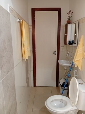 Shower, hair dryer, towels, toilet paper