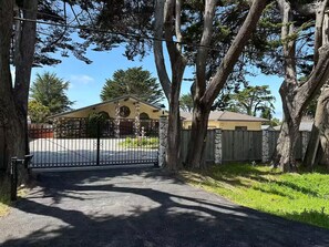 Set amidst mature trees, this two-story house offers a, shaded environment.
