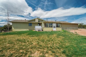 Enjoy a peaceful stay in this single-story home with a covered porch and backyard.