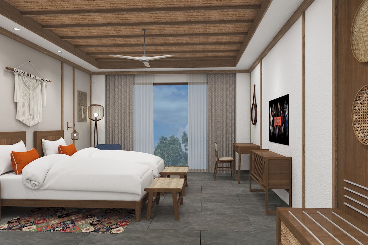 Ein modernes Schlafzimmer mit einem großen Bett, einem Schreibtisch und einem Stuhl. Ein Fenster bietet Blick auf Bäume.