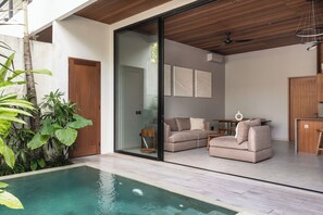 Deluxe Villa, Balcony, Pool View | Living area