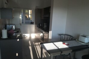 Fridge, stovetop, dishwasher, dining tables