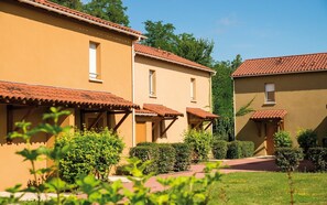 Residential-style buildings with living spaces and serene surroundings.