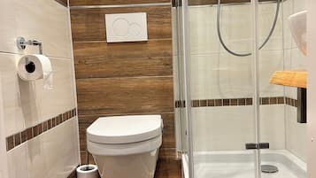 Shower, towels, soap, toilet paper