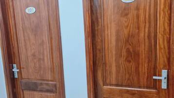 Two wooden doors with labels, one with a number '201' and the other with '202'.