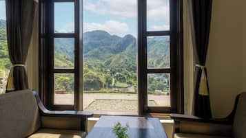 Deluxe Room With Balcony Mountain View | Premium bedding, desk, laptop workspace, free WiFi