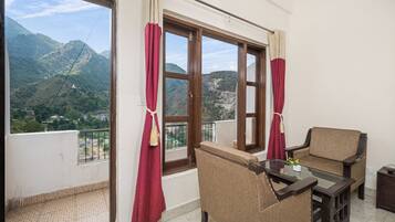 Deluxe Room With Garden View | Premium bedding, desk, laptop workspace, free WiFi